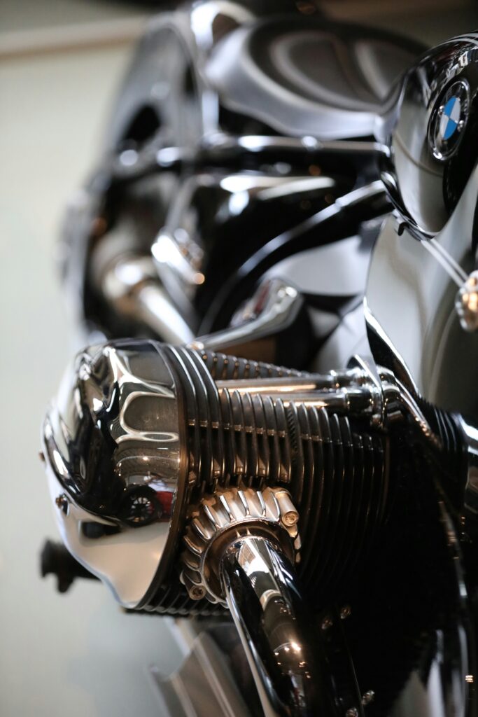 Close-up of a BMW motorcycle engine with chrome detailing and reflective metallic parts